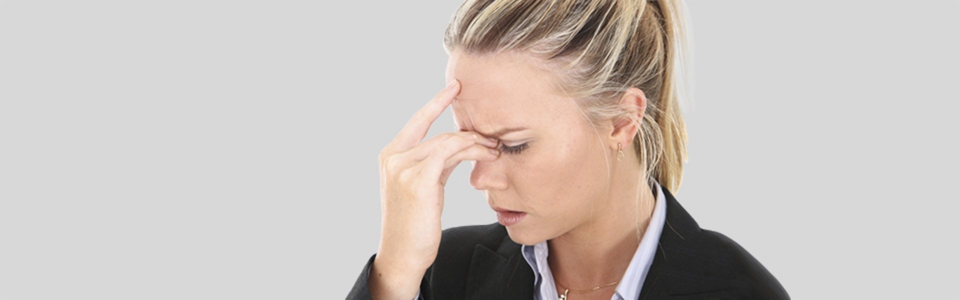 Woman experiencing a sinus headache